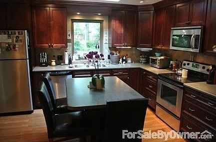 Updated Kitchen w/ stainless appliances
						:
						Top to bottom remodeled kitchen, hard wood, cherry custom cabinets with island