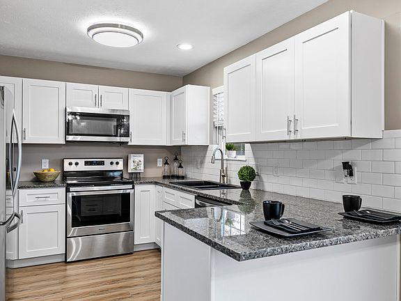Updated kitchen with window overlooking back yard
