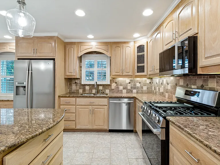 Kitchen with abundant cabinet space and stainless steal appliances.