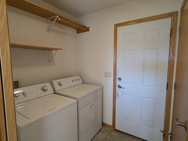 Entrance from garage to kitchen.
Door on right is storage closet.