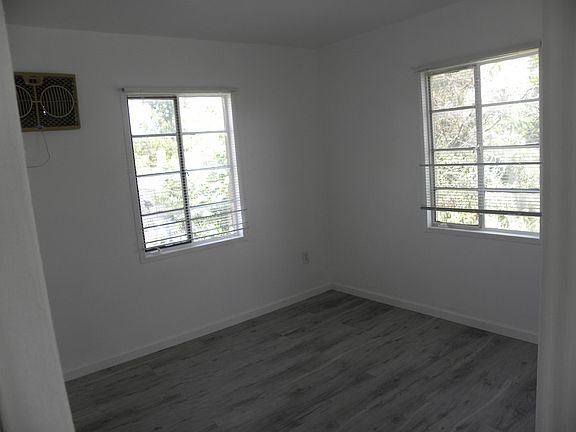 BEDROOM, NEW PAINT, NEW FLOOR, NEW BLINDS, DOOR ANGLE, PLENTY OF NATURAL LIGHTING.