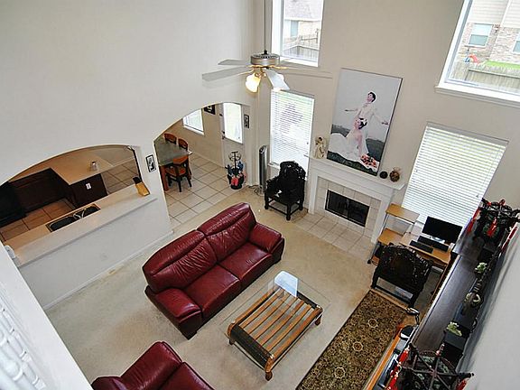 View of the cozy family room from above to show off the wall of windows.