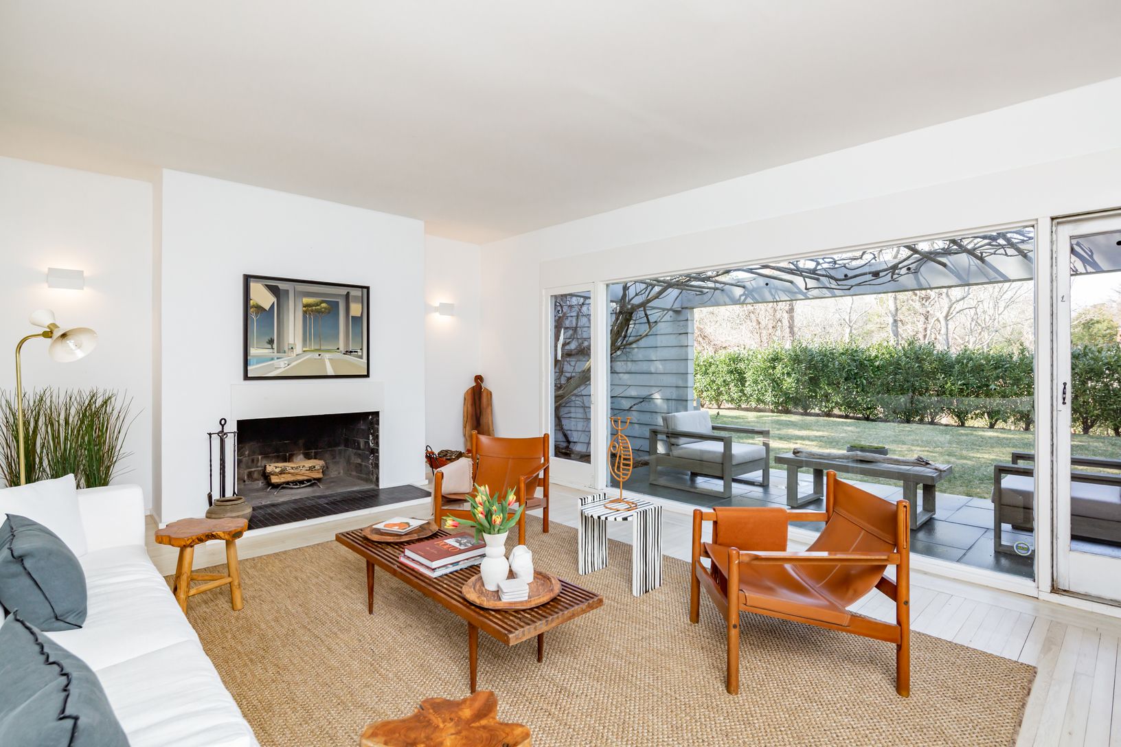  Living Room offers panoramic garden views and access to patio.