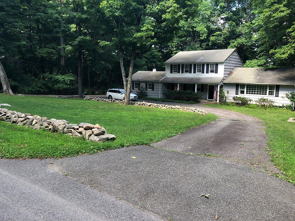 2 acre wooded setting in walkable neighborhood