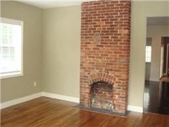 Living room with decorative fireplace