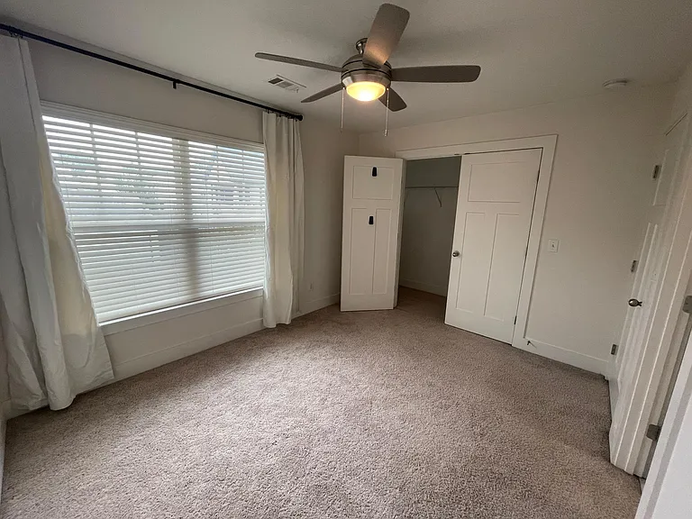 Bedroom 2 - huge window and ceiling fan with large closet