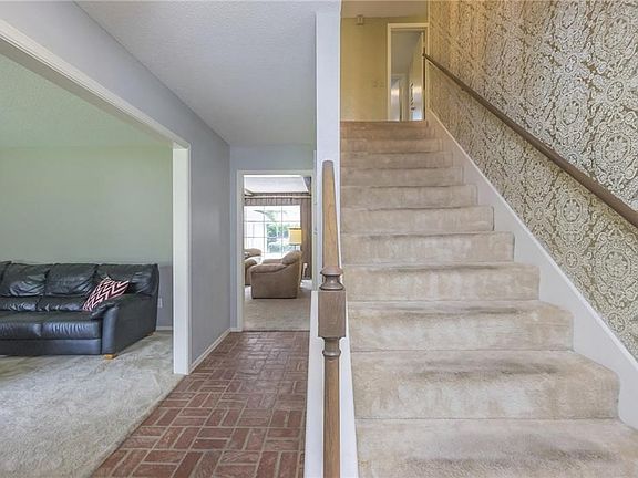 Formal living to the left and den just past the entry hall.