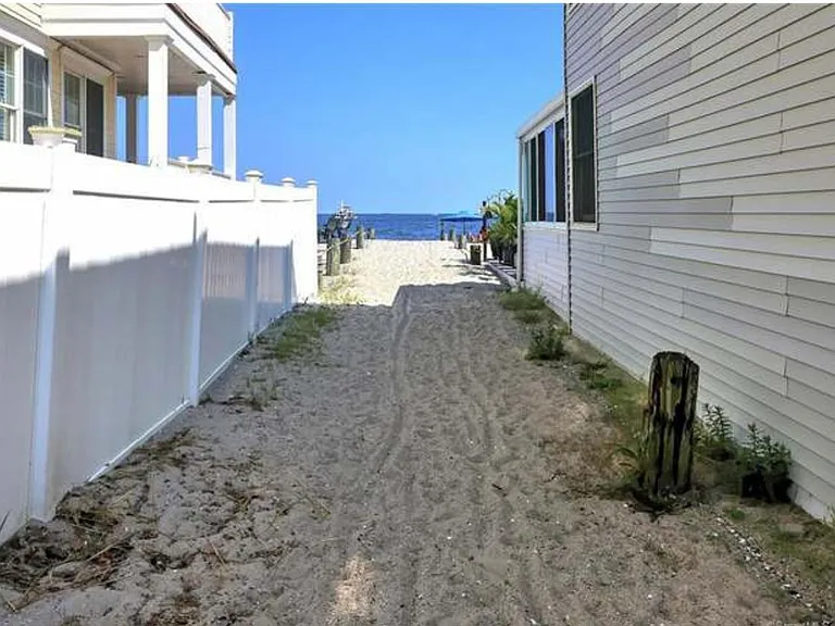 Only beach access directly across from this home, only one of two on entire strip