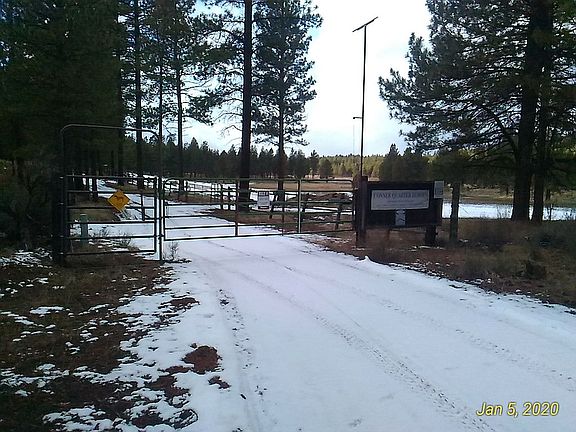 At entrance gate looking wes