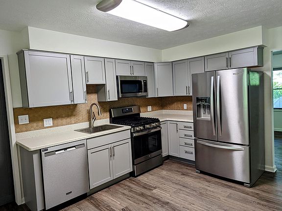 Kitchen - all appliances new in Spring 2022. Range has center griddle, 25" rectangular, extra deep stainless-steel sink, lots of cupboard space!