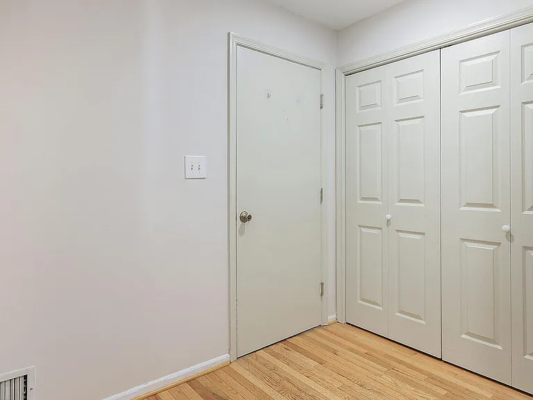 Entryway on First Floor w/Double Door Coat Closet and Garage Access.