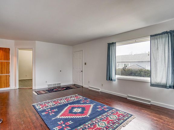 Large picture window in living room. Curtains included.