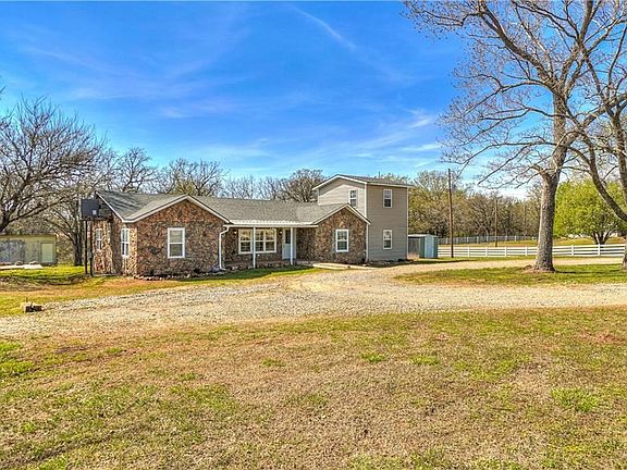 Front view of house from southwest of front yard.