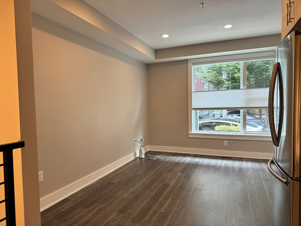 Living and dining room area (Right wall: 8'9", Window wall: 10'10", Left wall: 14'2")