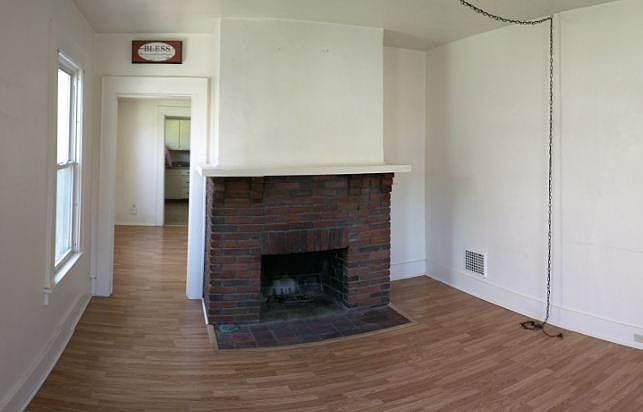 Living room with decorative fireplace