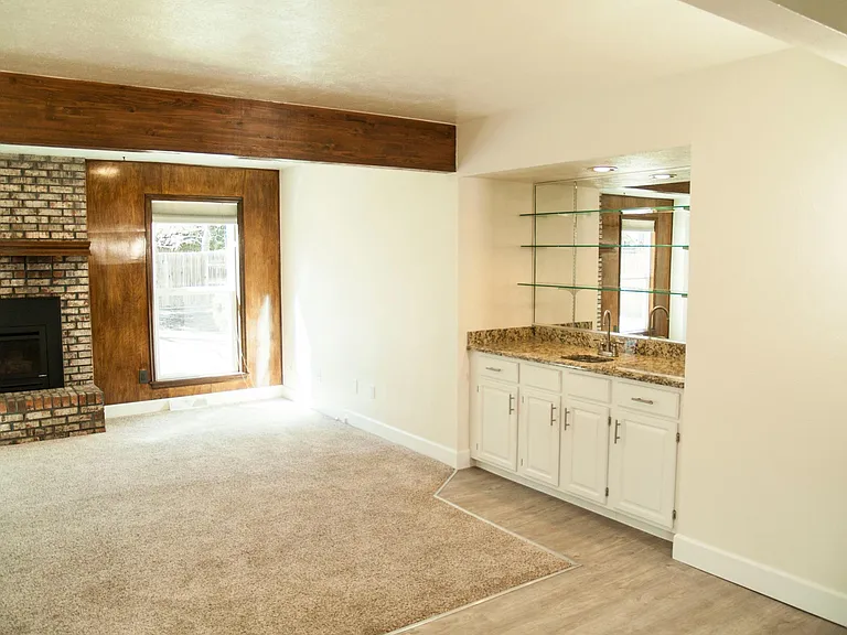 Wet bar and gas fireplace in Family Room