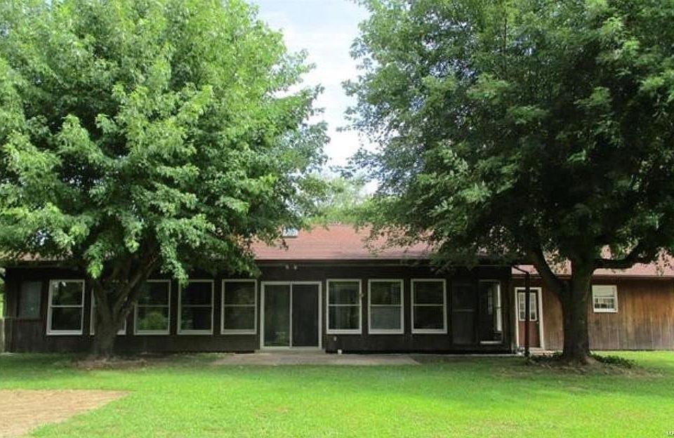 Beautiful Country Ranch Home, nestled back in a park like setting on level 8+/- acres,