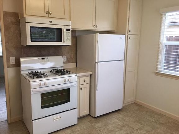 Free Standing stove with Overhead Microwave -Refrigerator will not remain
