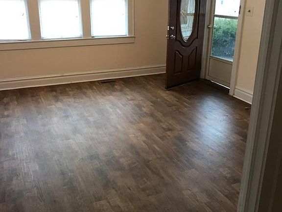 Living room looking at front door and porch