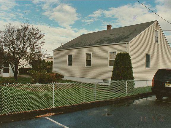 back view and side entrance to detached garage