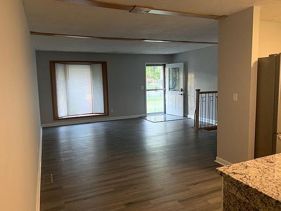 living room flowing to kitchen