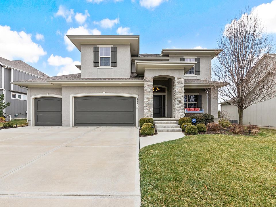 Exquisite front exterior, combining classic architecture with modern aesthetics. The tastefully landscaped front yard and welcoming entrance convey a sense of timeless sophistication, setting the tone for the entire residence.