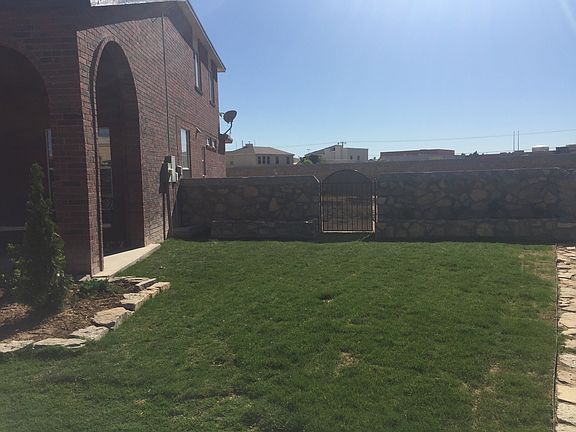 Newly lain sod & flower beds