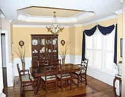 12  DINING ROOM WITH HARDWOOD FLOORS AND TREY CEILING.