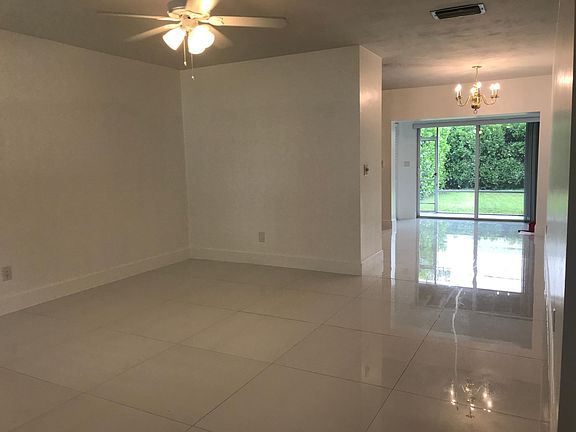 A view of the main part of the house and the sliding glass doors leading out to the totally private, landscaped backyard.
