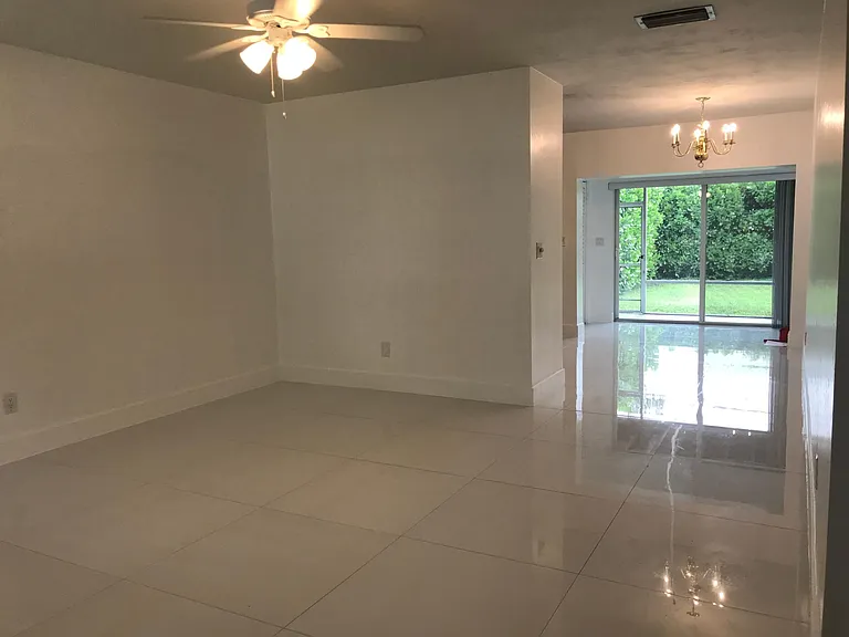 A view of the main part of the house and the sliding glass doors leading out to the totally private, landscaped backyard.
