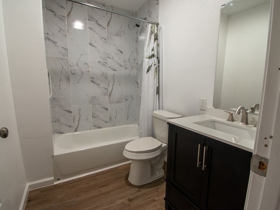 Bathroom in between kitchen, and living room