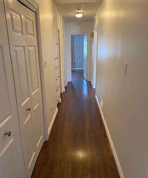 The wide hallway between 2 bedrooms. Storage in the hallway.