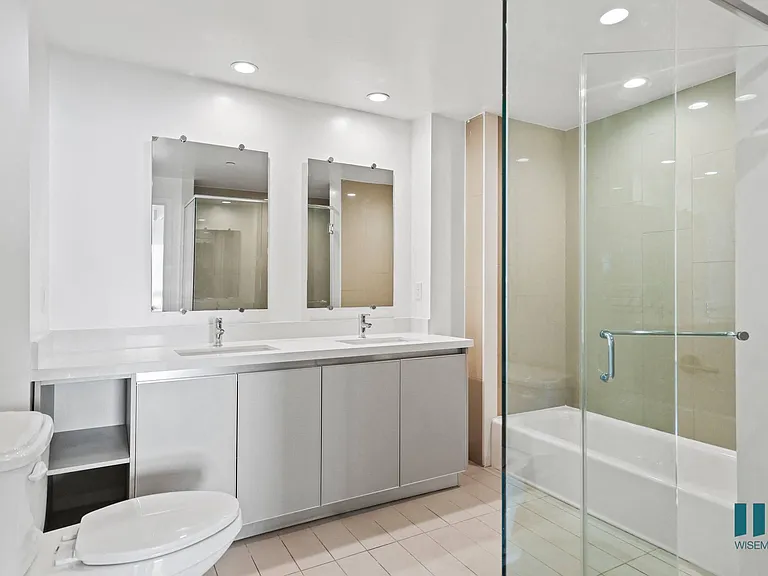 Bathroom with Walk-In Shower, Bathtub, and Double-Sink Vanity with Cabinet Storage