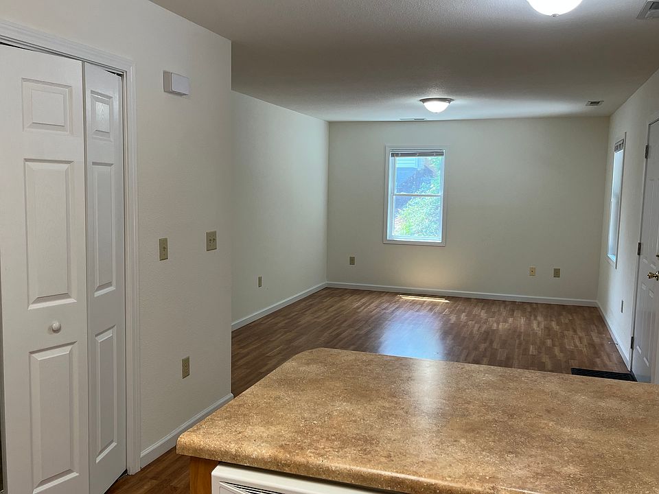 "Long" living space with living room area view from kitchen