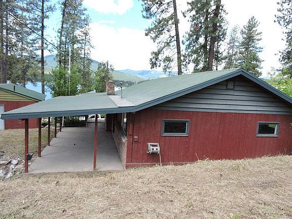 Back area of house looking down at covered patio a