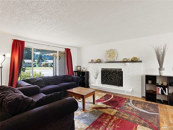 Plenty of natural light and real hardwood floors featured in the main living area unit 4221