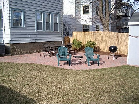 Landscaped backyard with new patio