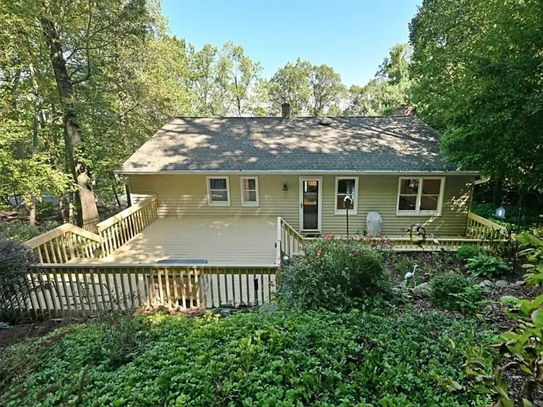 This is the back of the house. The views from the back of the house are into a beautiful forest.