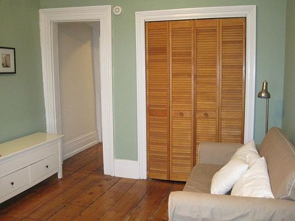 Closet and hallway to kitchen