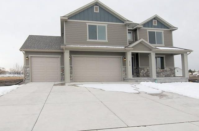 Photo is of a similar house on a different lot.