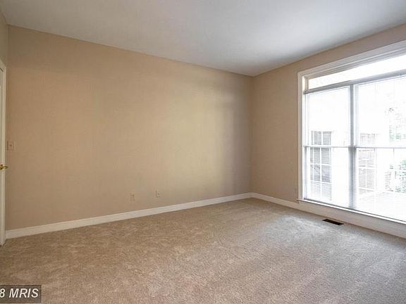 Bedroom facing front of home. Large windows