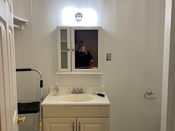 Bathroom with shower . Closet to left