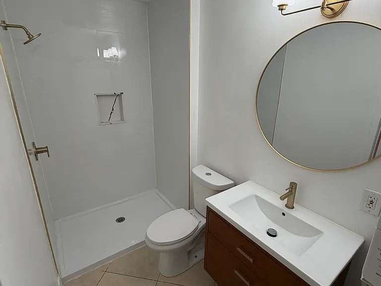 Bathroom _ Private bathroom with modern tiled shower and recent renovation.