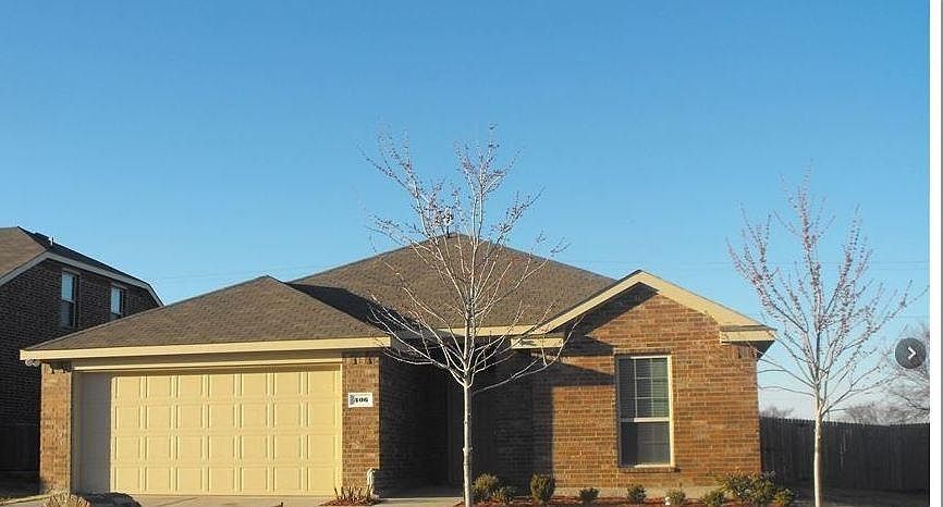 Gorgeous stone brick house with landscaped front yard