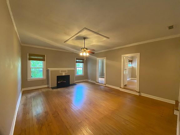 Great room, with high ceiling hardwood floor and fireplace