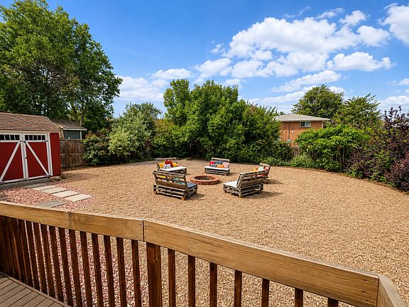 Fire pit with pallet chairs staying. And the red shed is included too!