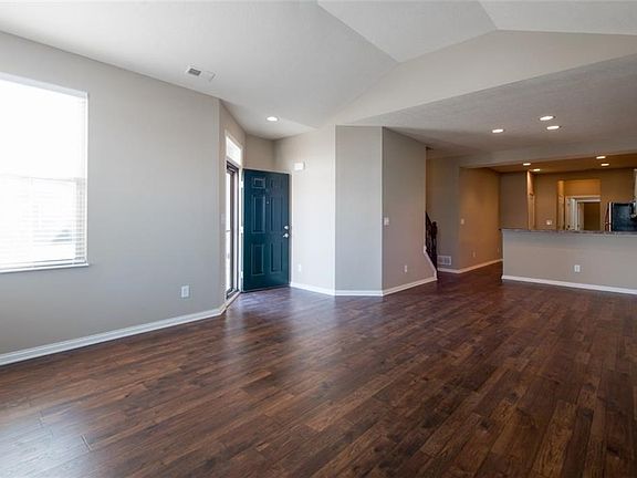 View of dining area and looking into kitchen. Great room, dining and kitchen all with new beautiful laminate flooring