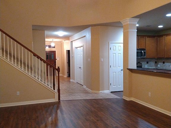 Looking from living room into foyer; kitchen on right.