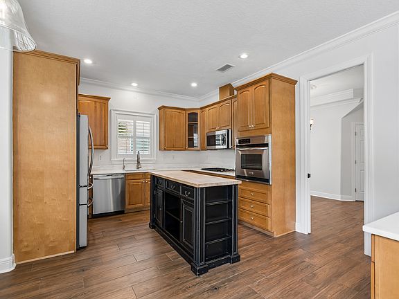 Kitchen with Farm Sink, RO Water System, Convection Microwave Oven, Stainless Steet Appliances and Wolf Gas Cooktop