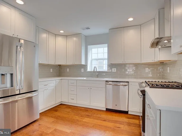 Kitchen with high end appliances and countertops